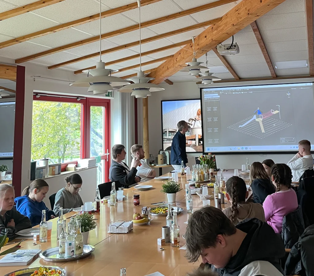 A presentation to the children on the production of playground equipment.