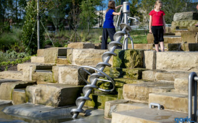 Stainless steel Archimedean screw transports water in the Gatton Park Lexington water playground